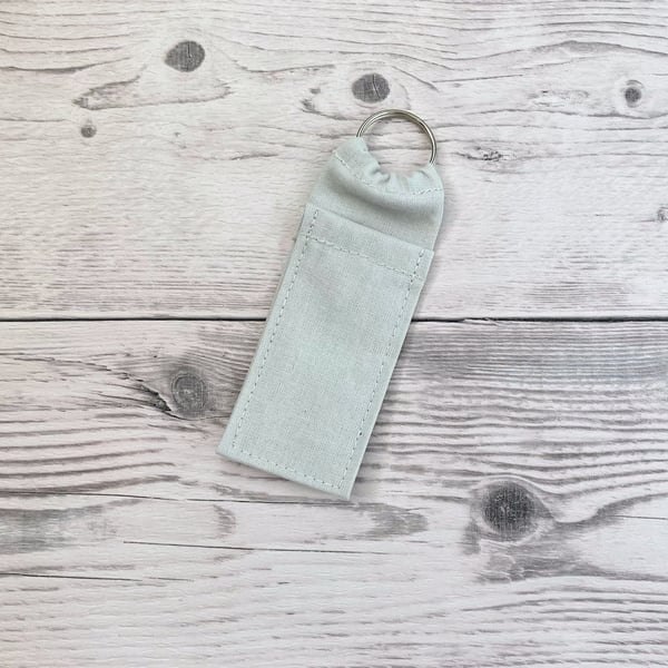 Light grey plain lip balm holder. Lipstick cotton fabric keychain.