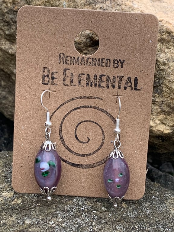 Pretty purple glass earrings, with inlayed flower design