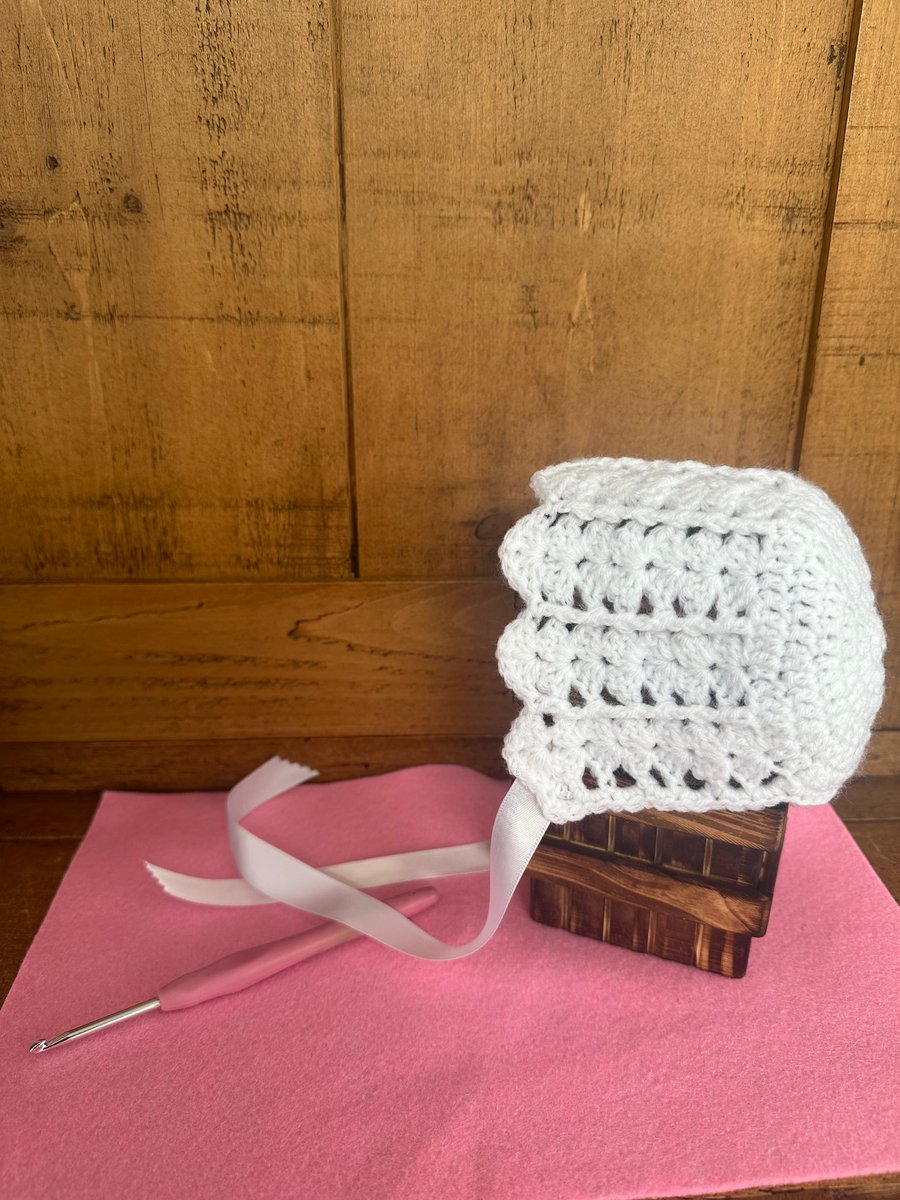 Crochet white baby bonnet