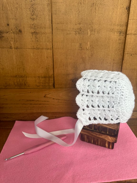 Crochet white baby bonnet