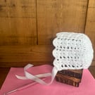 Crochet white baby bonnet