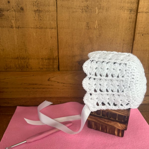 Crochet white baby bonnet