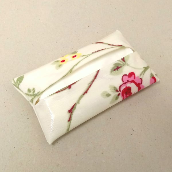 Tissue holder in white with flowers and a pink butterfly, tissues included.