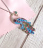Sky blue peacock pendant with rose gold, turquoise and purple accents - Image 5