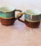 Stoneware pottery mug finished in a Turquoise and Copper colour glazes.
