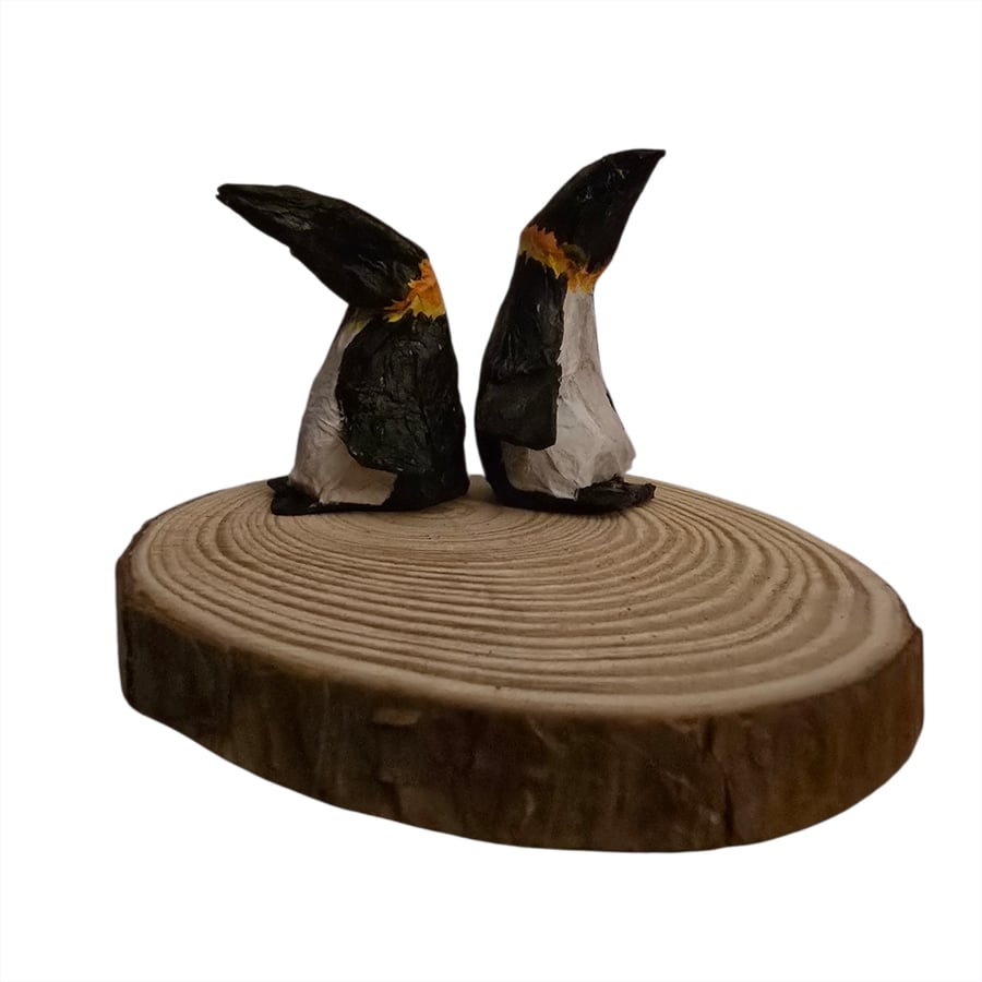 Handmade paper mache pair of penguins
