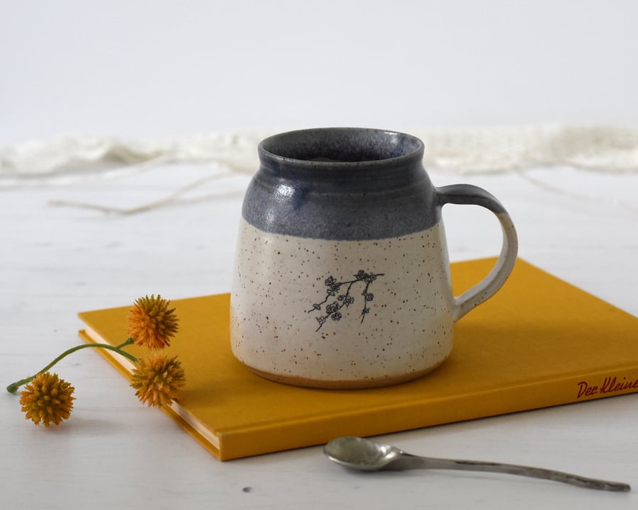 Handmade ceramic mug with rose illustration, blue and white pottery