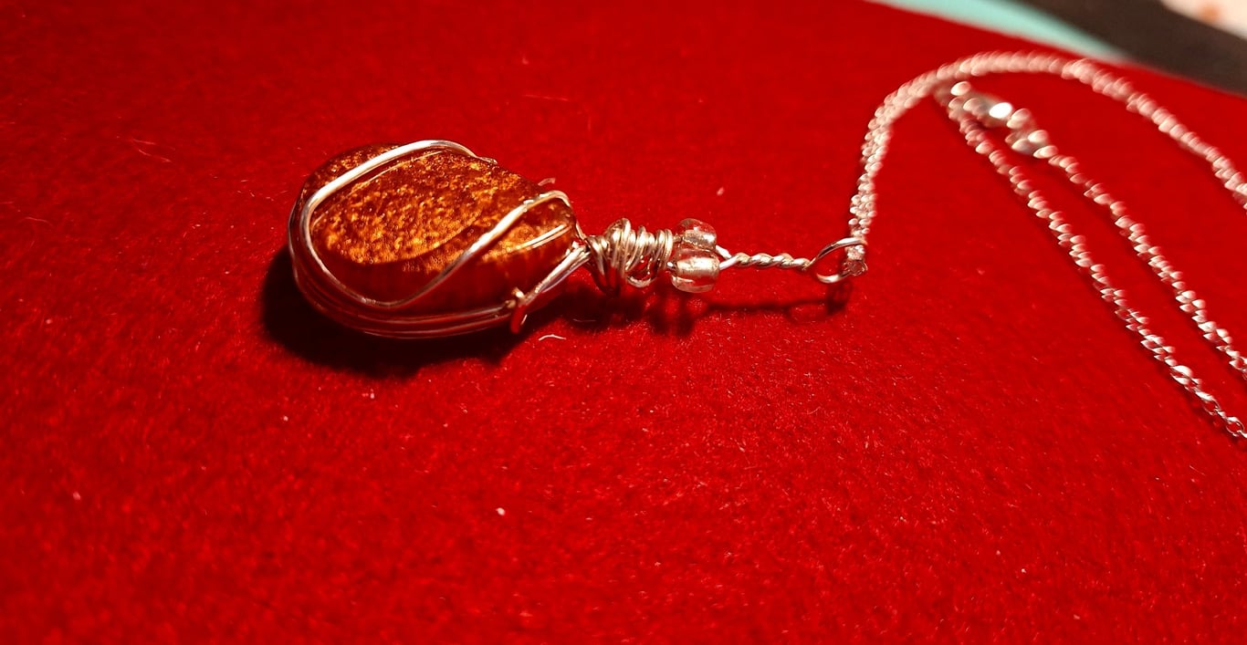 Summer seconds - Amber colour resin and sterling silver pendant