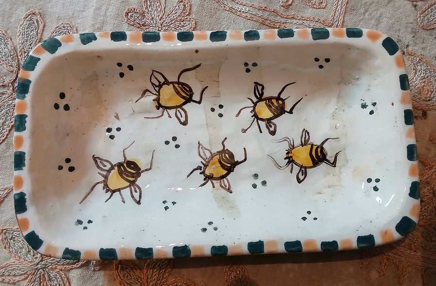 Square slip ware dish with hand painted bee design