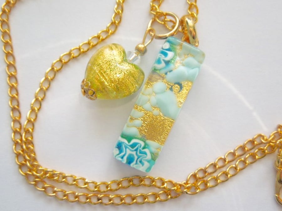 Gold and blue Murano glass heart pendant with Swarovski and gold chain.