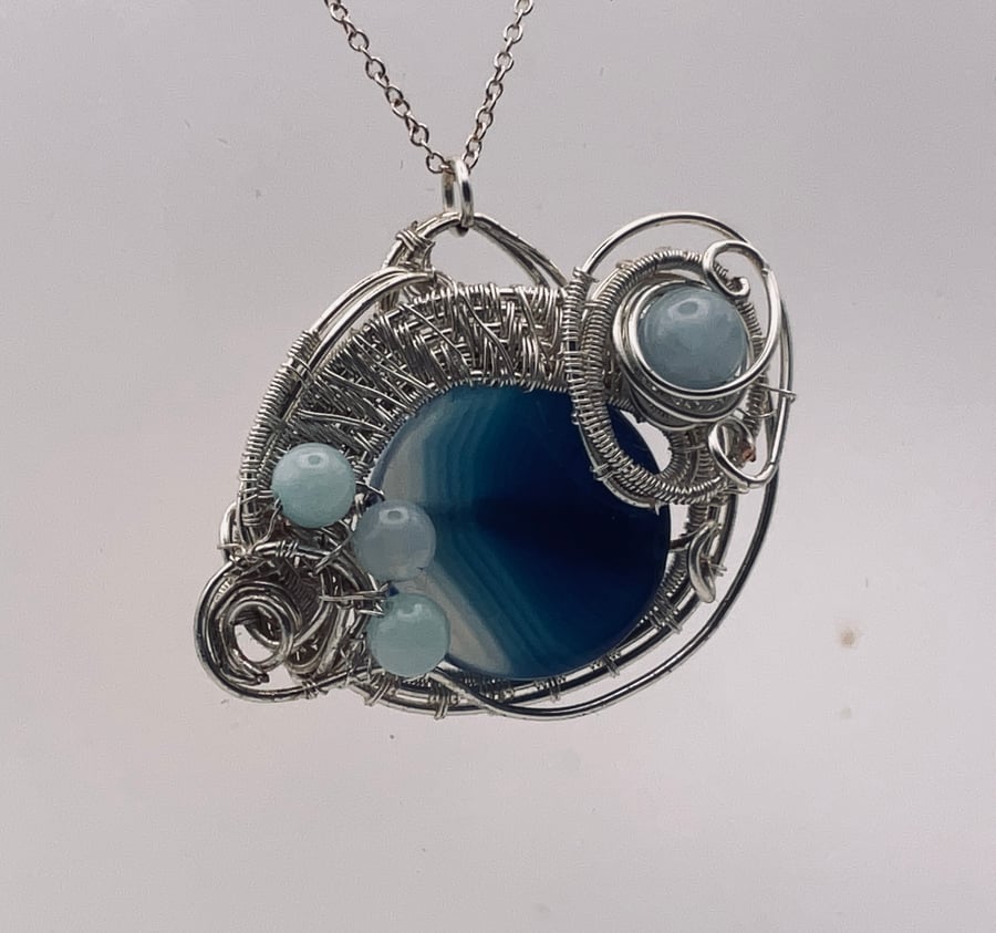 Beautiful blue  banded agate, silver wired pendant