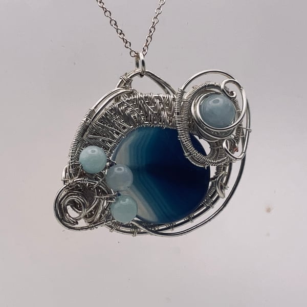 Beautiful blue  banded agate, silver wired pendant