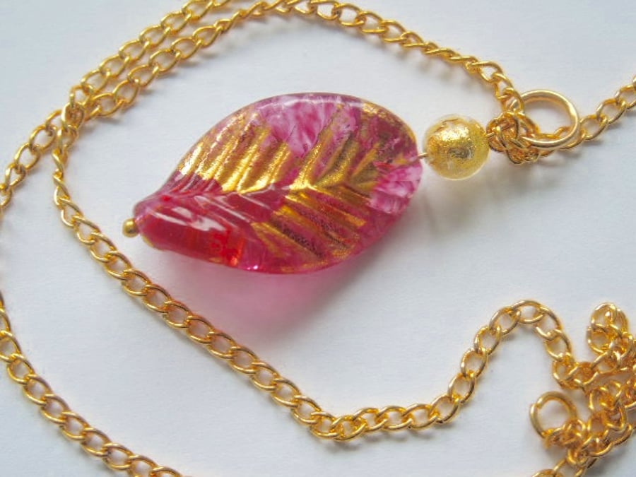 Pink and gold Murano glass leaf pendant.