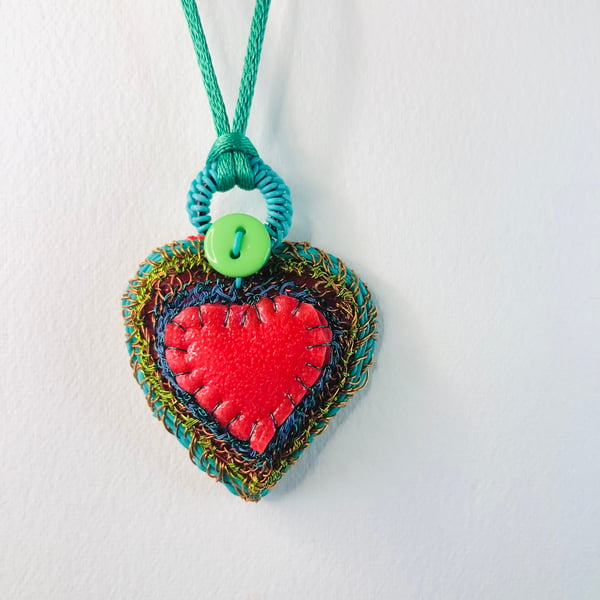 Turquoise edged red rubber and wire heart pendant from recycled materials