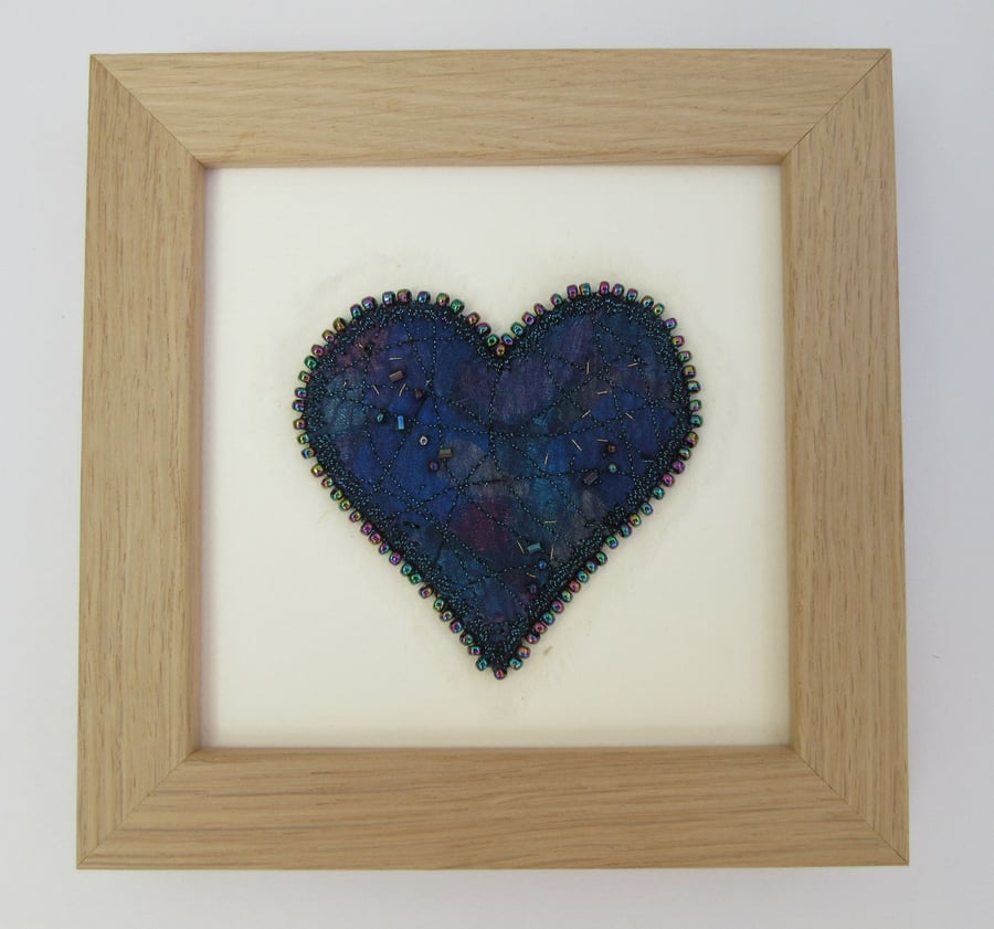 Blue love heart picture.  Turquoise and blue fabric heart with beaded edge