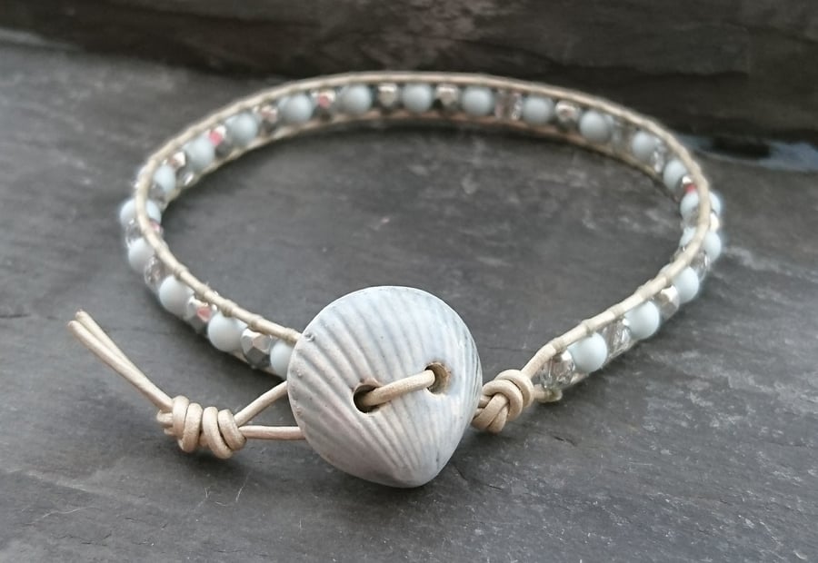 Ceramic shell button, leather and glass bead bracelet, silver and pale blue