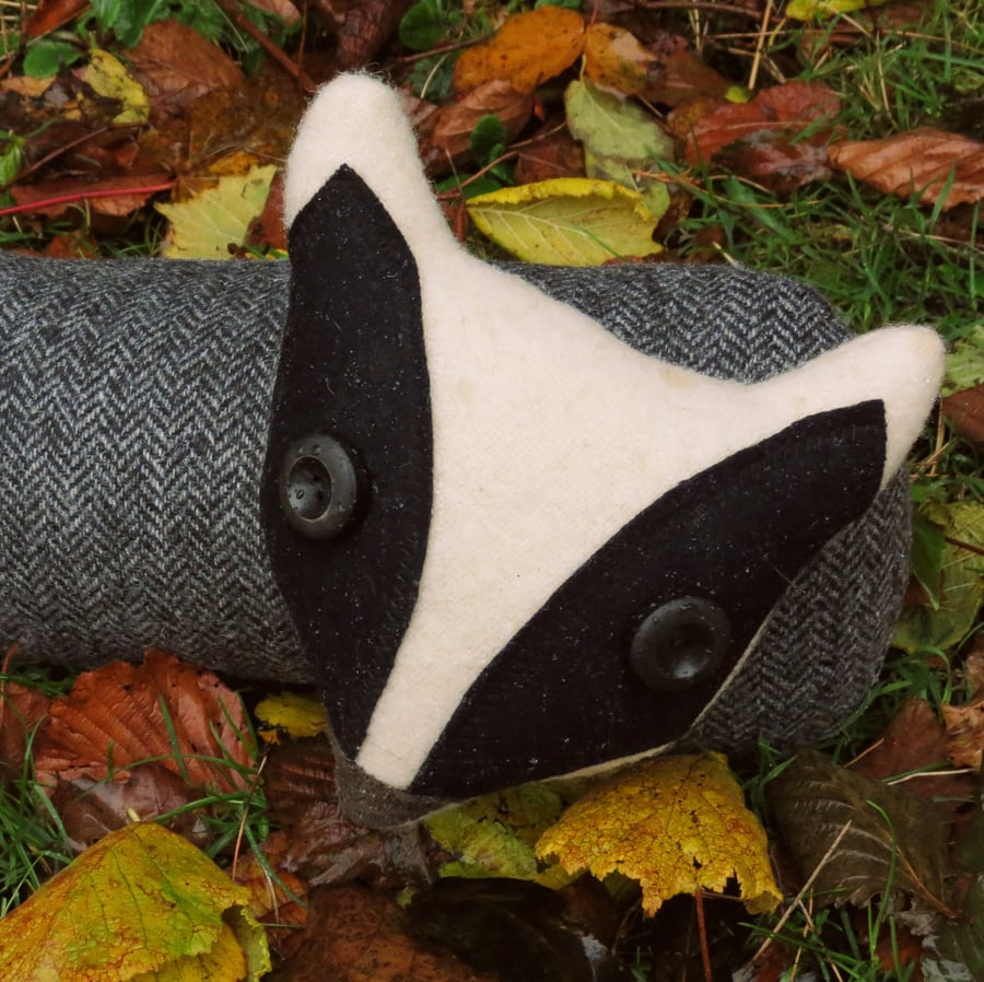 The curious badger.  A badger draught excluder made from herringbone wool.