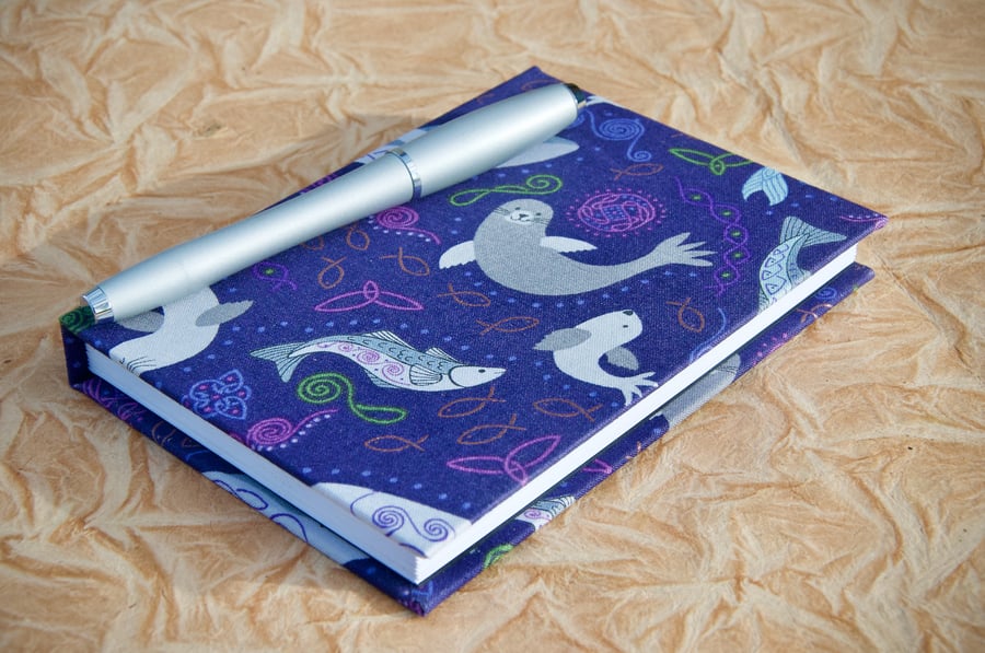 A6 Lined Notebook with full cloth smiley sea creatures cover