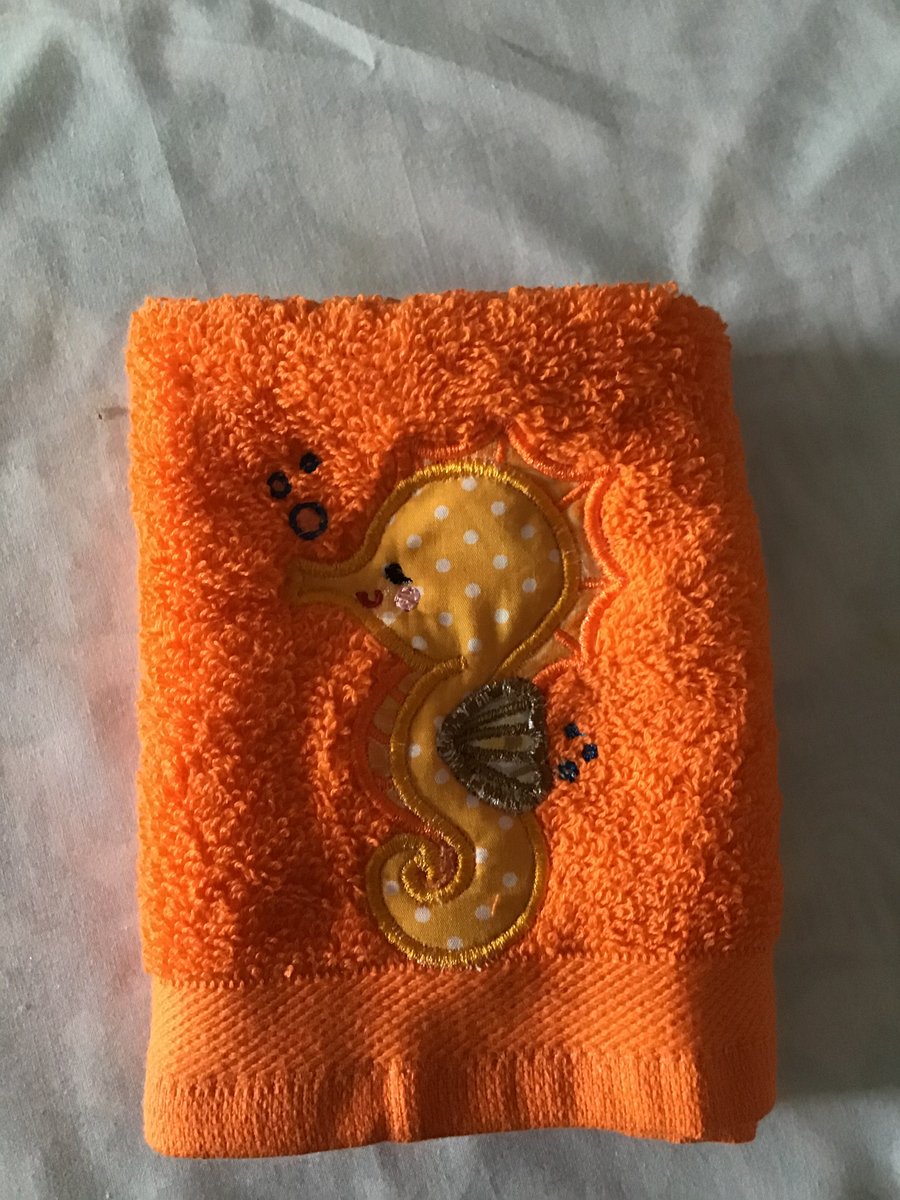 Orange Flannel with an appliquéd seahorse 