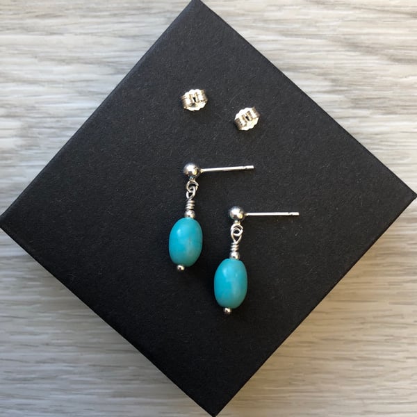 Turquoise semi precious drop post earrings. Sterling silver 