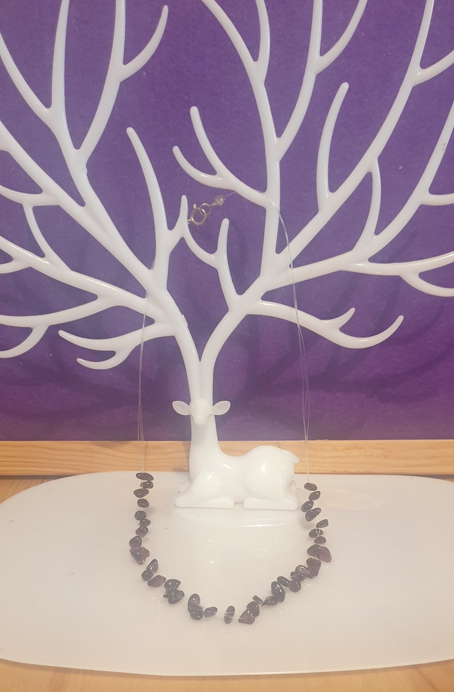 Floating garnet gemstone necklace.