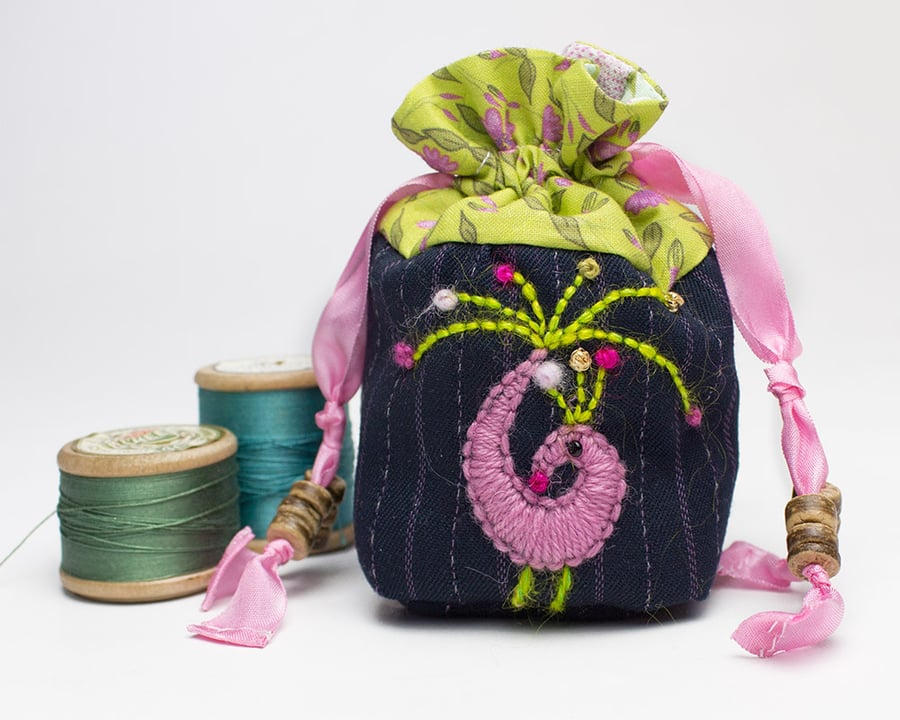 Miniature navy pinstripe drawstring bag with hand embroidered peacock