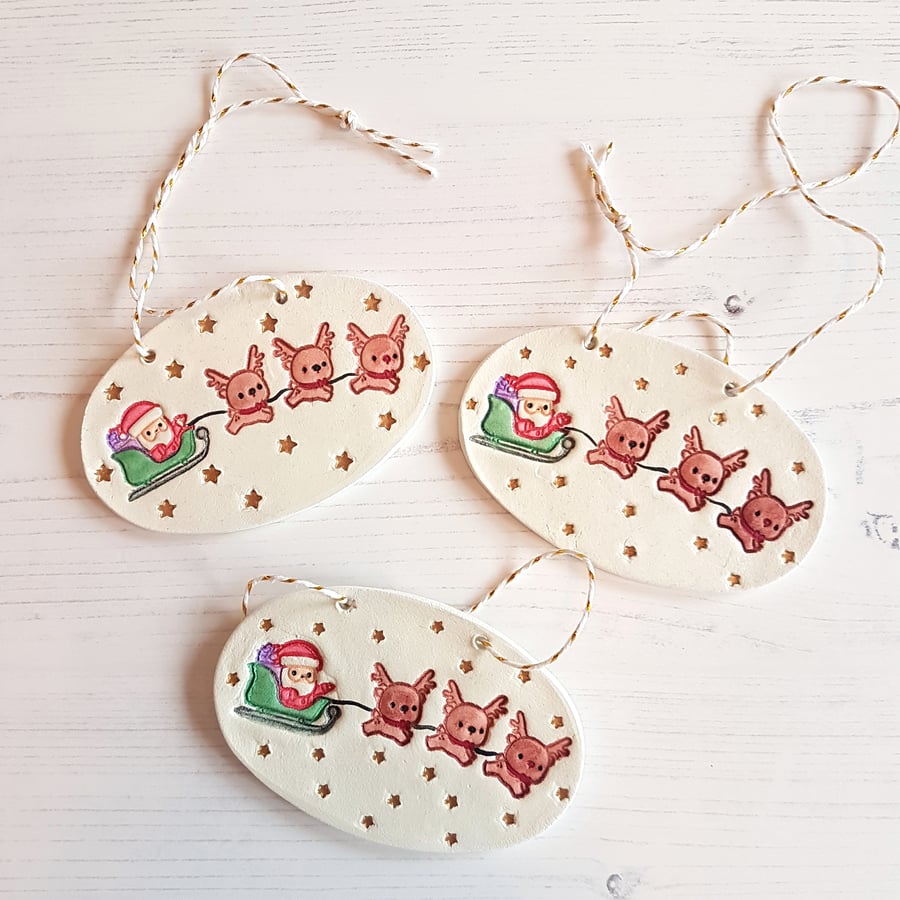 Santa and his reindeer hanging plaque decoration