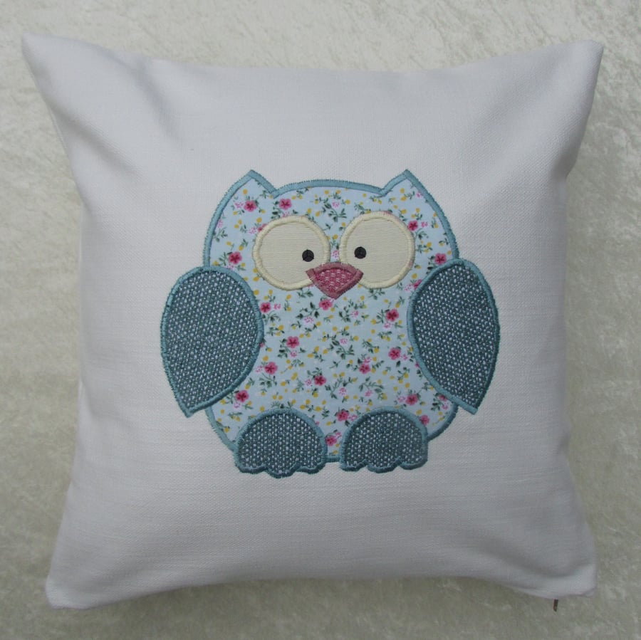 Owl cushion in cream with aquamarine floral owl