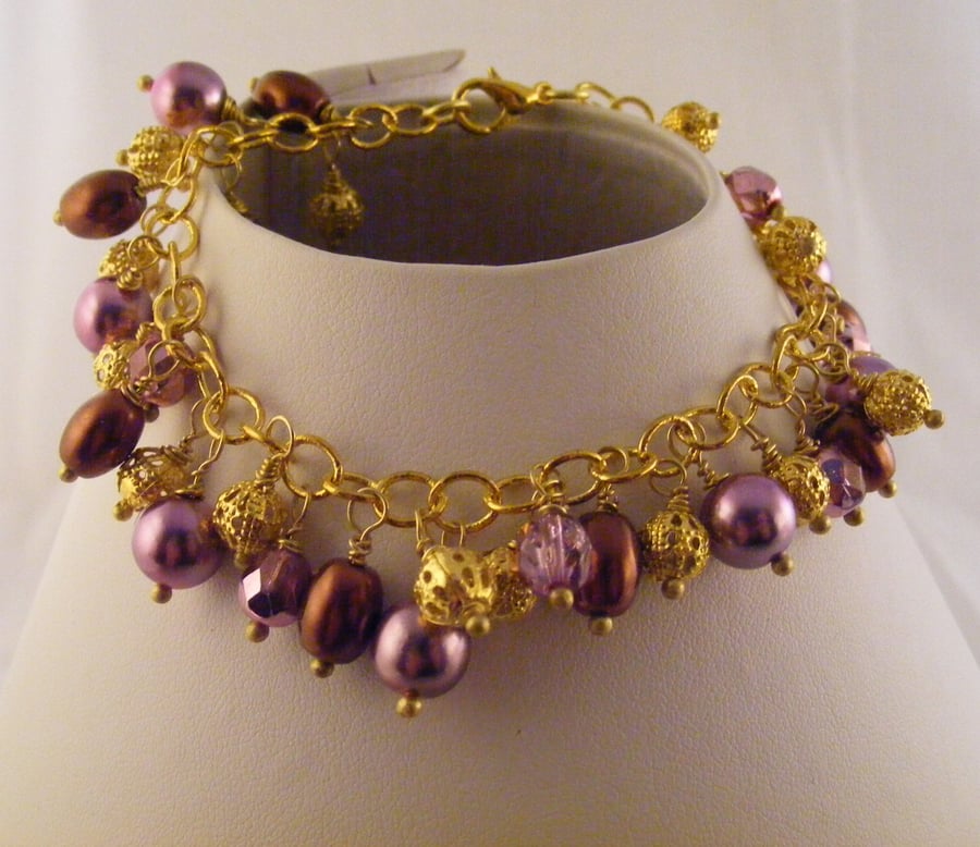 Brown, Pink and Gold Charm Bracelet.