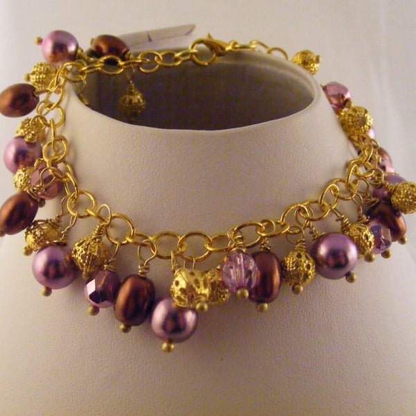 Brown, Pink and Gold Charm Bracelet.