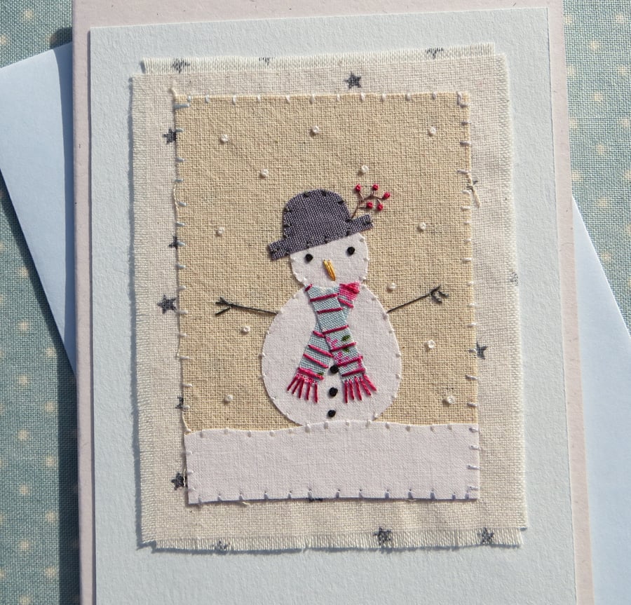 Sweet little snowman card with starry background and berries in his hat!
