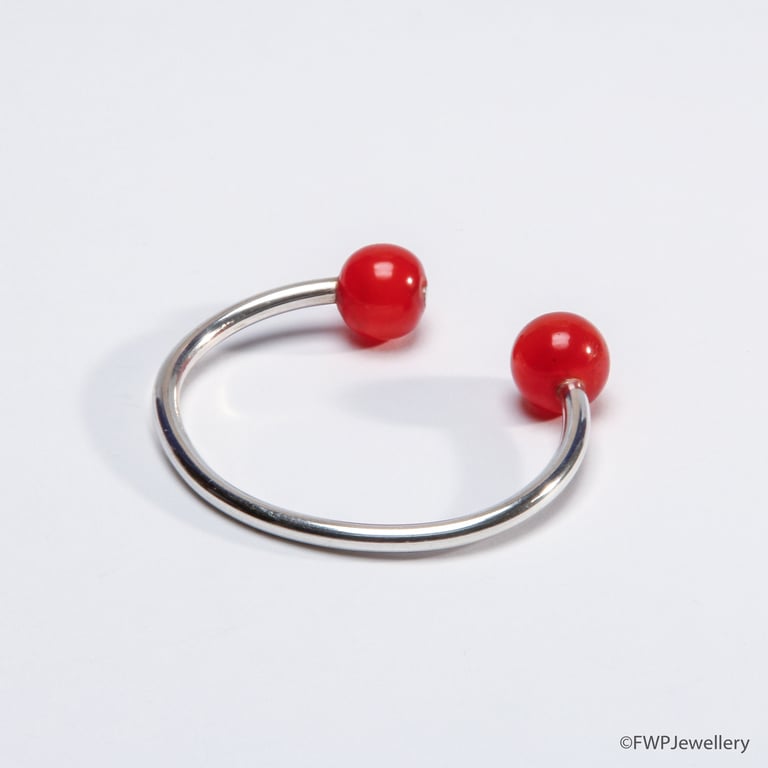 Chic Open silver bangle with orange bead ends