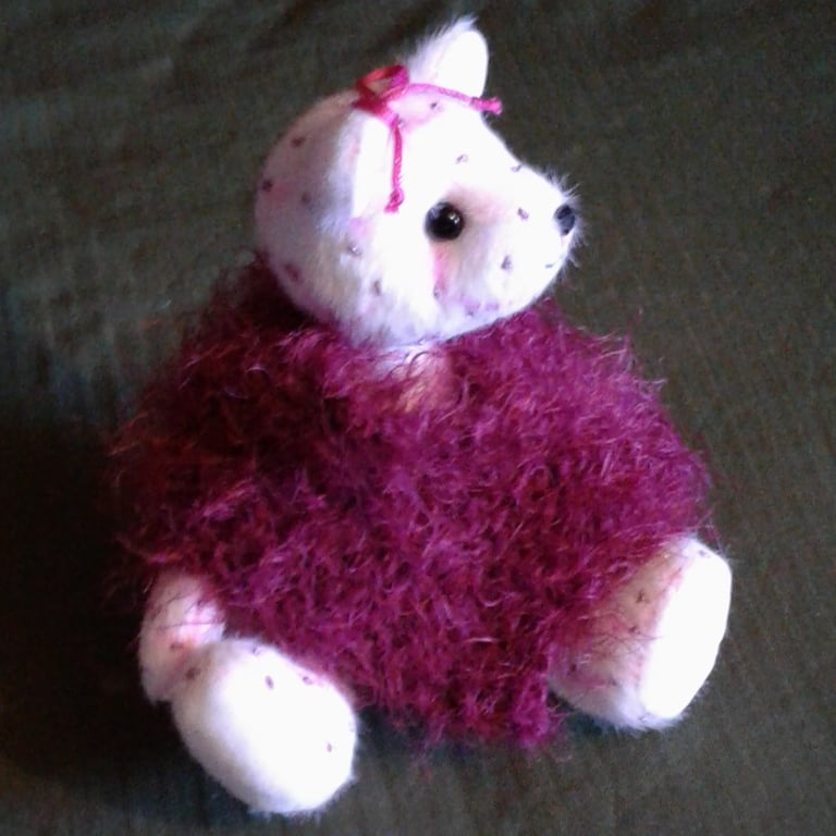 Belle, an 8" collectable bear with 'party fever'