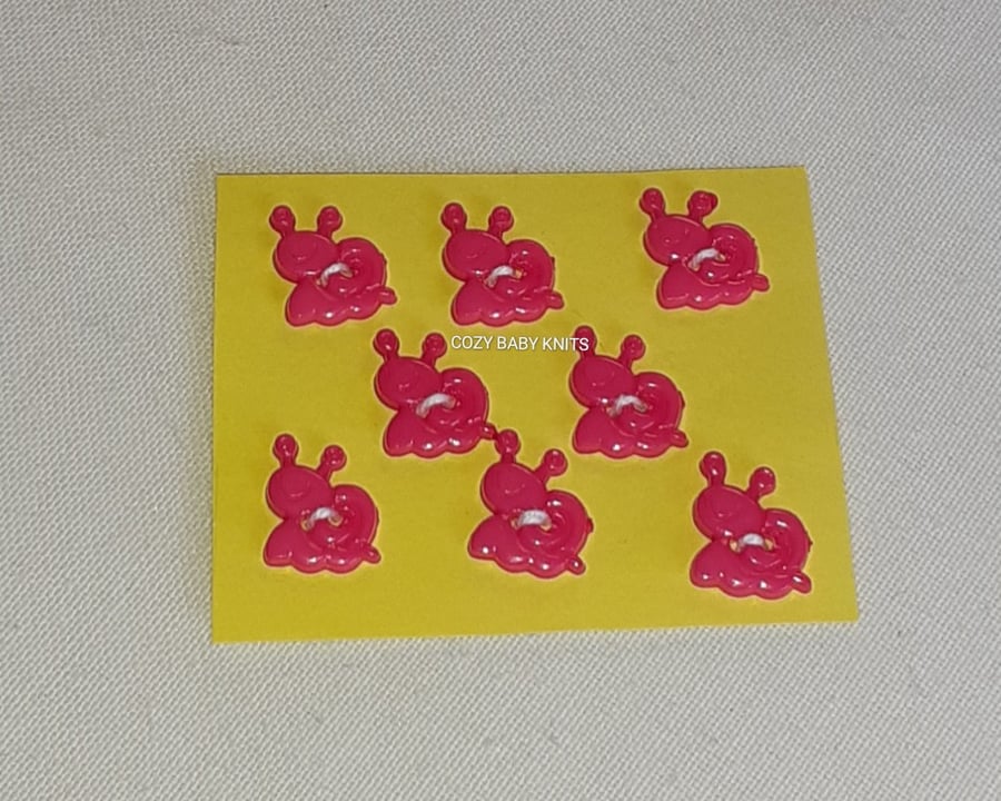 CERISE SNAIL SHAPED BUTTONS WITH TWO HOLES  FOR ATTACHING 