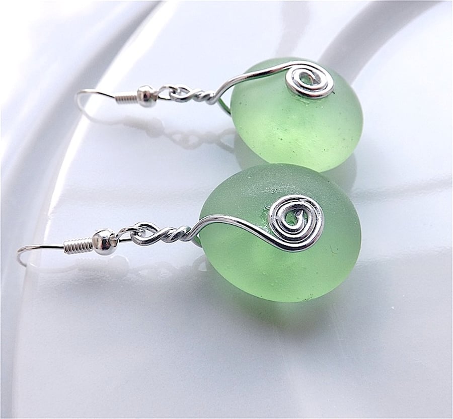 Soft green sea glass dangle earrings, for pierced ears.
