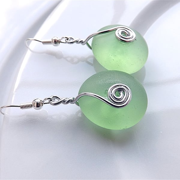 Soft green sea glass dangle earrings, for pierced ears.