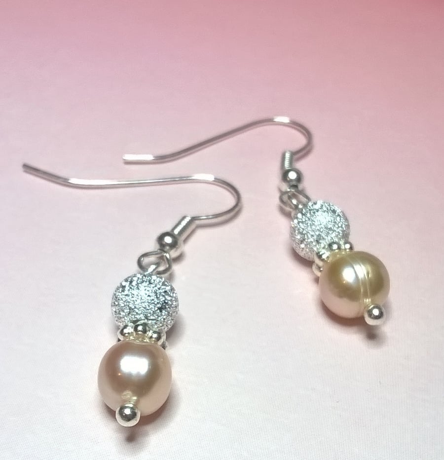 Peach cultured pearl and stardust bead earrings