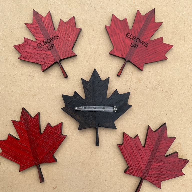 Canadian leaf shaped badge