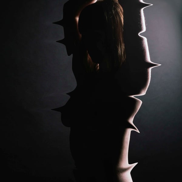 Girl in a Darkened Room