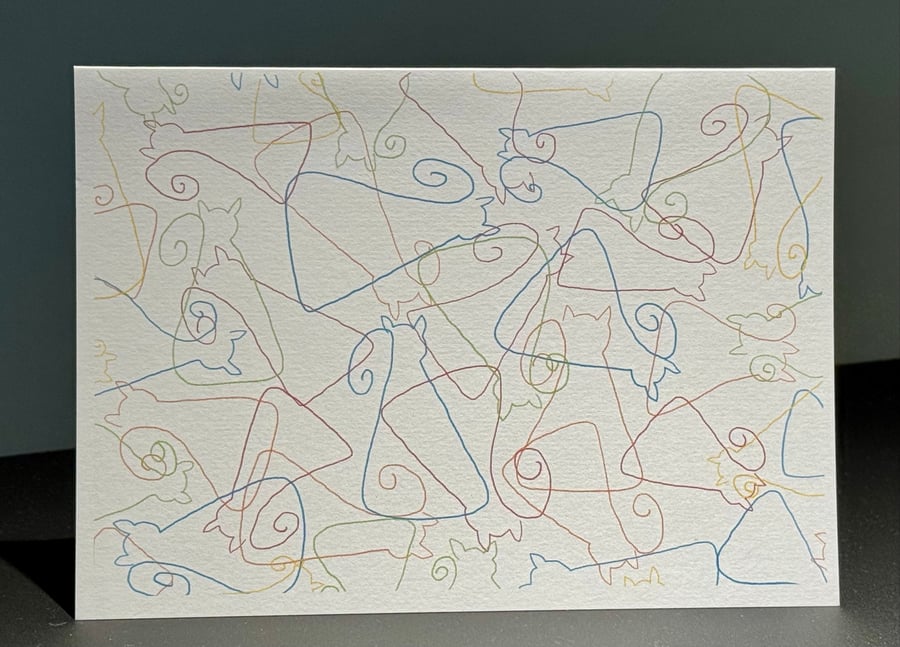 A Pack of Four Blank Cards Featuring Colourful Scattered Cats