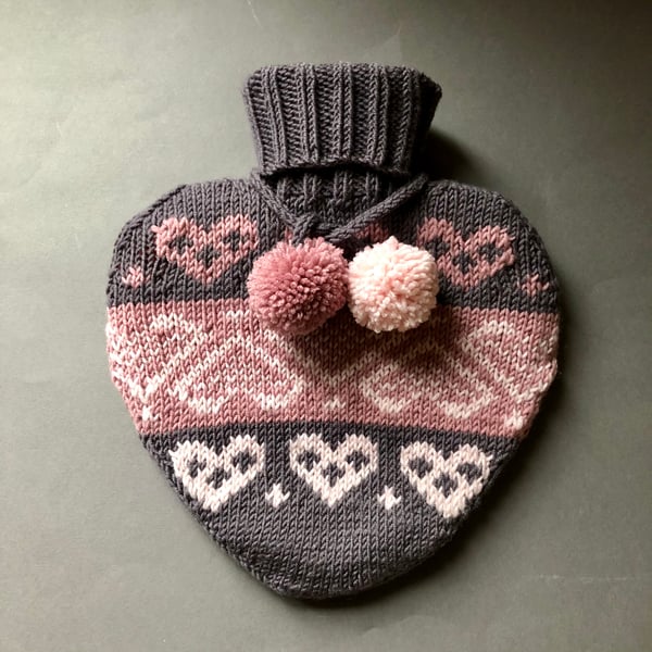 Heart shaped hot water bottle with hand knit cover