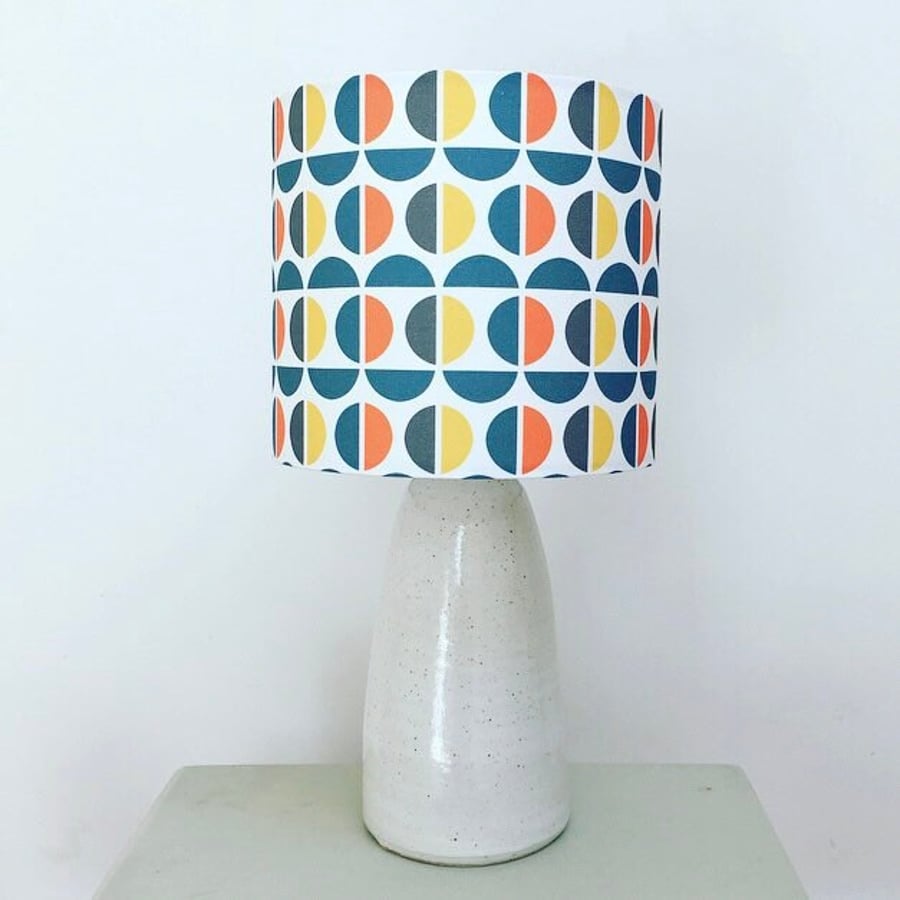 Handmade bold geometric fabric drum lampshade in orange, teal, mustard and grey