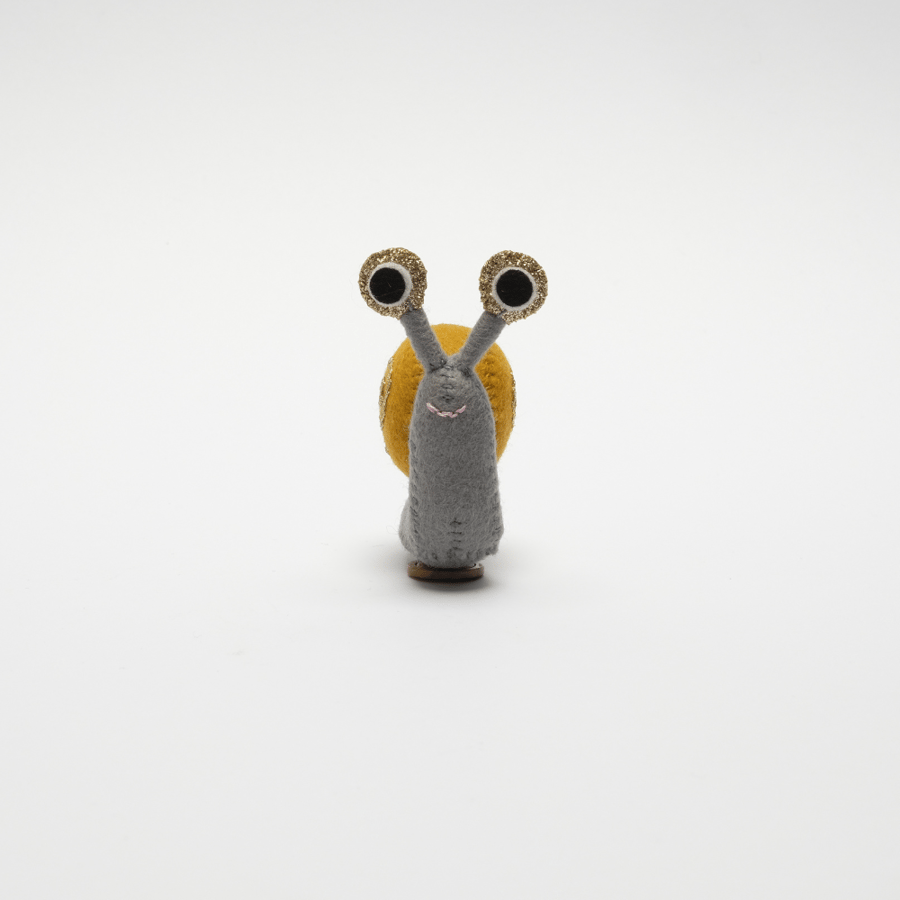 Felt snail ornament with glittery details
