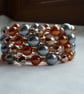 COPPER AND GREY MEMORY WIRE BRACELET.   - Image 1