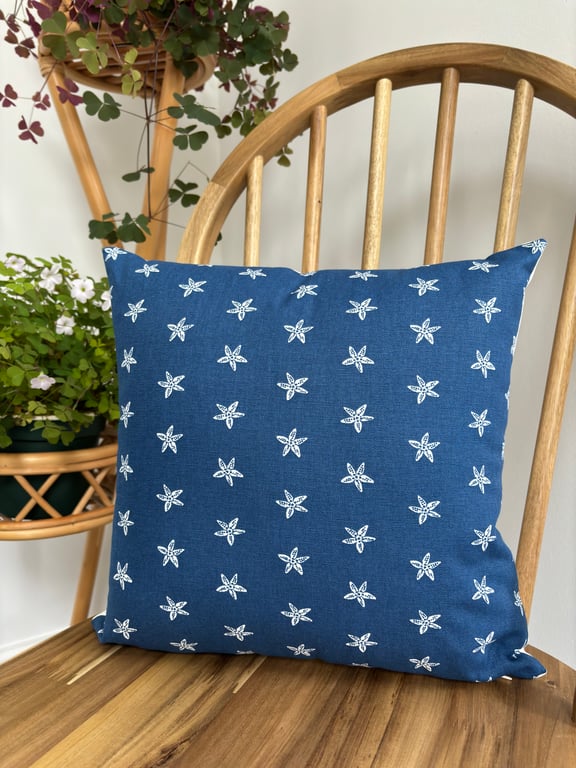 Cushion cover in navy with white starfish print, 36cm x 36cm