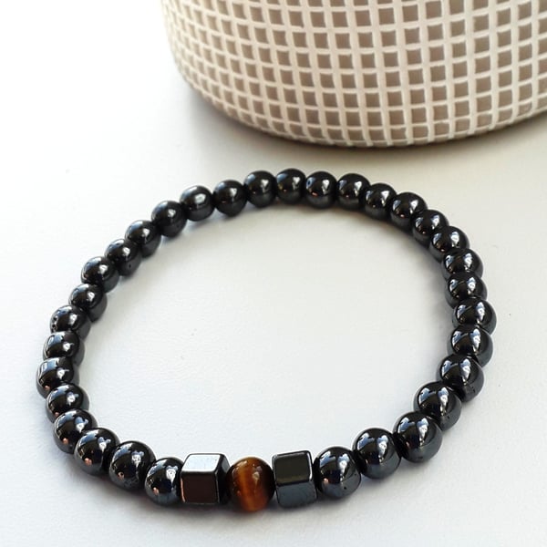 Hematite Stretch bracelet with gold tiger eye feature bead unisex