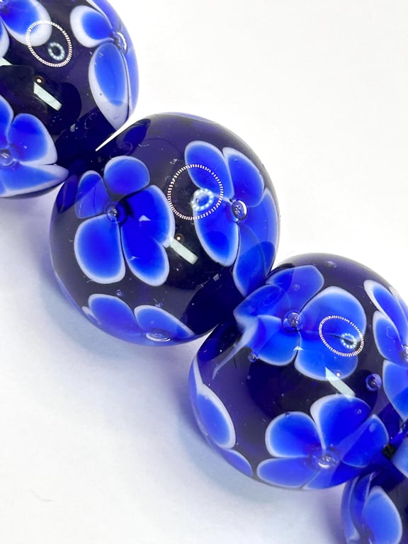 Handmade blue floral patterned lamp work glass beads