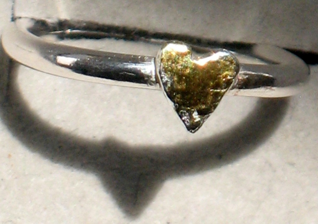 Stack ring with gold heart.