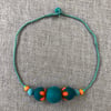 “Bottle” felt bead necklace