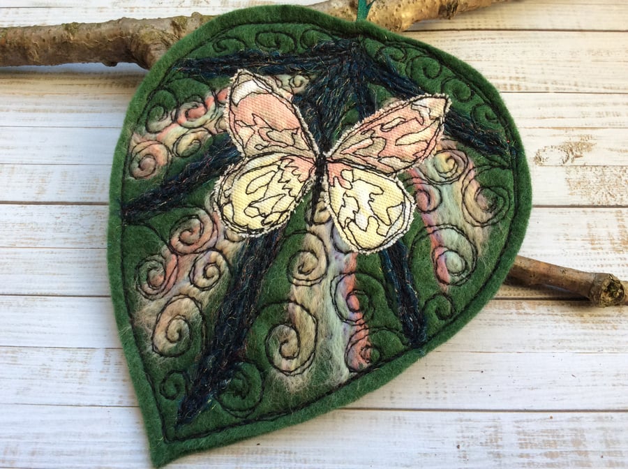 Embroidered butterfly and leaf home decoration. 
